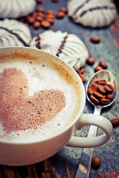 Cup of aromatic coffee with heart and coffee beans — Stock Photo, Image