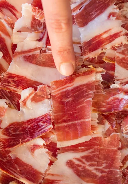 Picking serrano ham — Stock Photo, Image