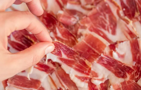 Picking serrano ham — Stock Photo, Image