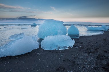 Blue icebergs and sea