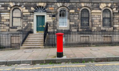 Sidewalk, facades and typical red british postbox clipart
