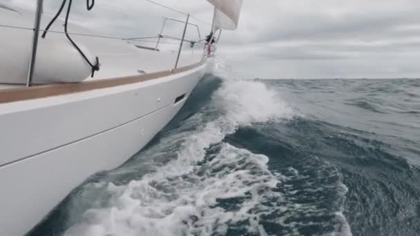 Sailing ship bow sailing into the waves in slow-mo — Stock Video