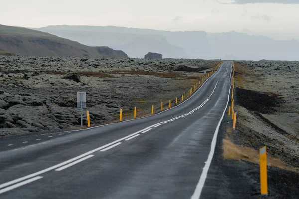 Wet Isolated straight road after the storm in Iceland — Stock Photo, Image