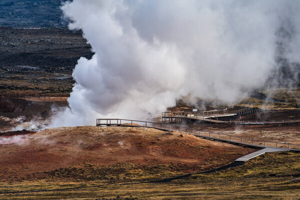 Fumaroles over the hills with wooden paths