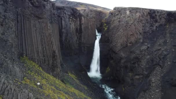 Approaching flight to basaltic waterfall in Iceland — Stock video