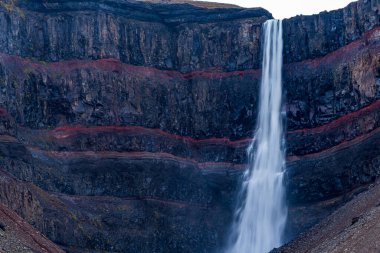 Svartifoss waterfall and red layers in Iceland