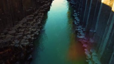 Flying over Studlagil canyon in iceland with Basalt columns