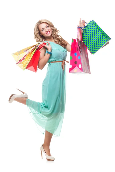 Menina loira segurando sacos de compras — Fotografia de Stock