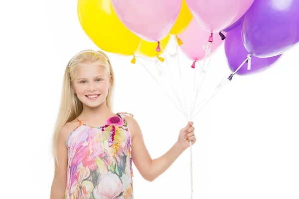Chica joven sosteniendo globos — Foto de Stock