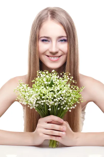 Woman with lily of the valley — Stock Photo, Image