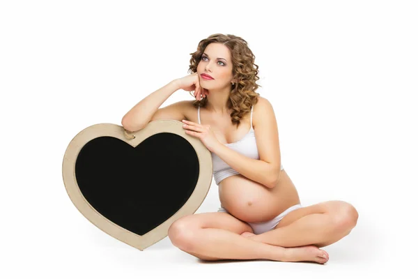 Pregnant woman with chalkboard — Stock Photo, Image