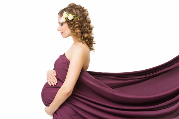 Pregnant woman in fabric Stock Picture