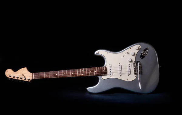 Silver electric guitar isolated on black background — Stock Photo, Image