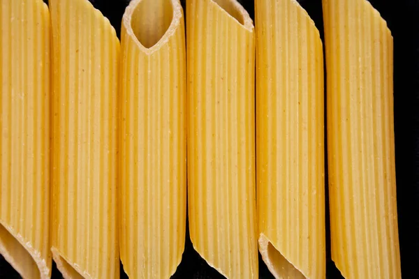 Raw Penne Pasta Close Black Background — Stock Photo, Image