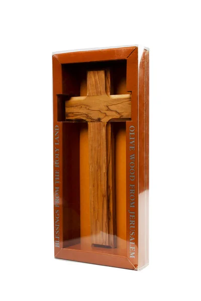 Wooden crucifix standing in box on white background. — Zdjęcie stockowe