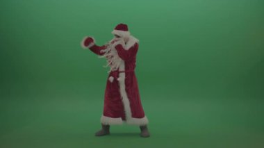 man in santa claus costume boxing  isolated on green background