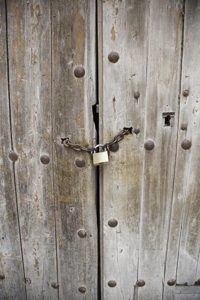 Wooden door with padlock — Stock Photo, Image