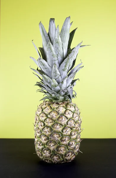 Pineapple on yellow — Stock Photo, Image