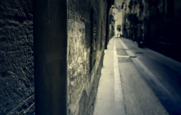 Detail of old medieval street in a town in Spain, history and tourism