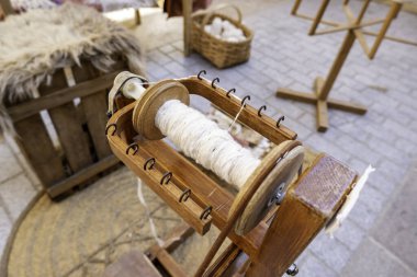 Detail of old wooden machine for spinning thread