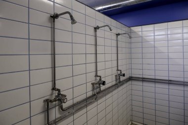 Detail of showers for men in a gym