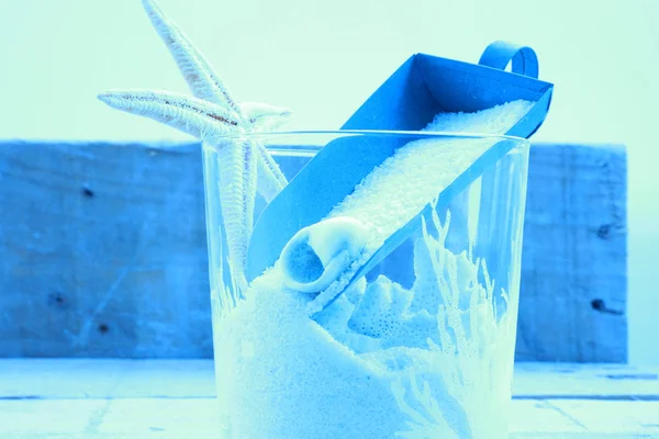 Sand and sea star in blue background — Stock Photo, Image