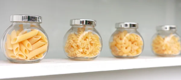 Italian pasta in row — Stock Photo, Image