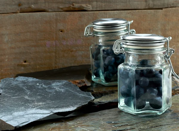 Little jars & blueberries — Stock Photo, Image