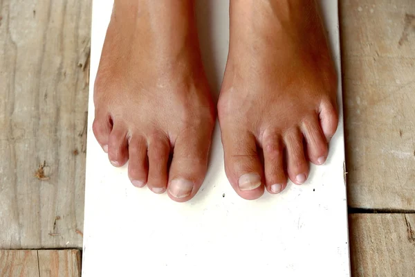 Feet on wood — Stock Photo, Image