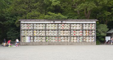 Japanese sake rice wine barrels with decorative writing in Tsurugaoka hachi