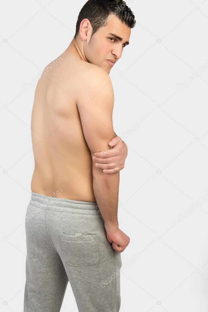 Muscular man with muscle pain 