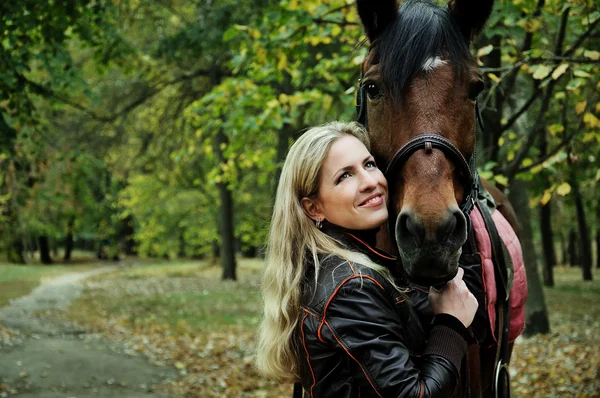 Portrait of blonde woman with horse — Stock Photo, Image