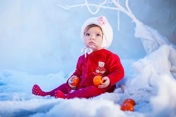 Baby girl and Christmas snow — Stock Photo, Image