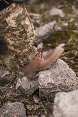 Soldier in beige leather tactical sneakers