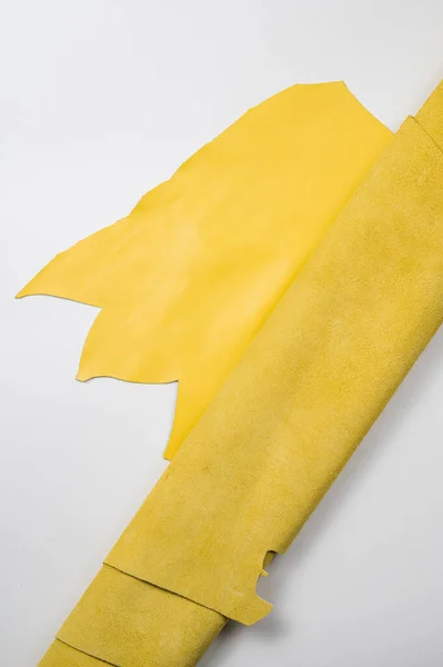 Yellow roll of genuine leather. Wallpaper. Yellow leather for shoes and bags