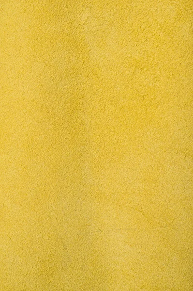 Yellow roll of genuine leather. Wallpaper. Yellow leather for shoes and bags