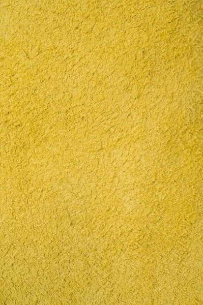 Yellow roll of genuine leather. Wallpaper. Yellow leather for shoes and bags