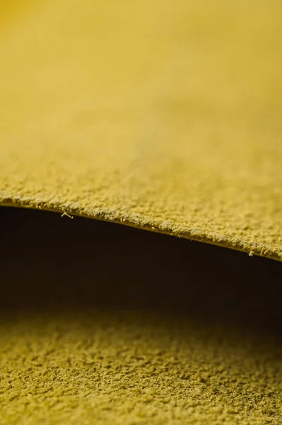 Yellow roll of genuine leather. Wallpaper. Yellow leather for shoes and bags
