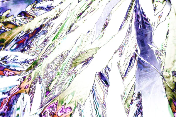 Мікрокристали тирарової кислоти в поляризованому світлі — стокове фото
