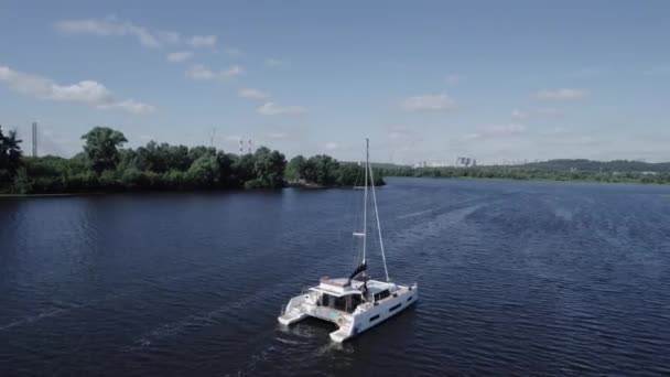 Drone view, big yacht sailing the river with a beautiful view on the landscape — Stock Video