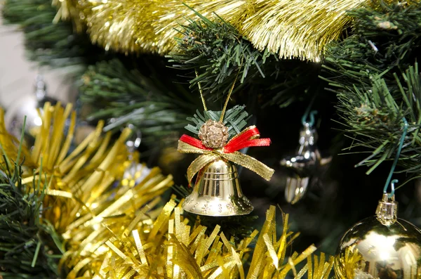 Bell and other toys on the Christmas tree — Stock Photo, Image