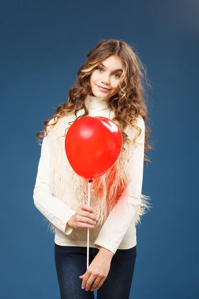 Young cute girl with heart-shaped ballon — Stock Photo, Image