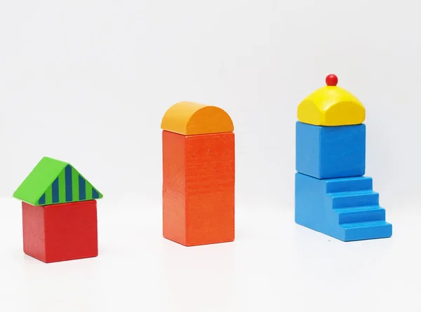 Tři hračky domy — Stock fotografie