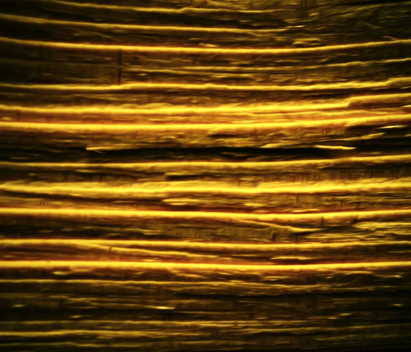 Blurred golden colored striped pattern — Stock Photo, Image