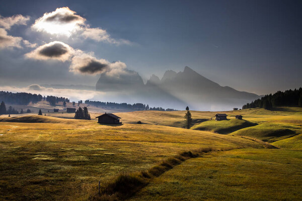Sunrise on Seiser Alm mountain meadow in Dolomites