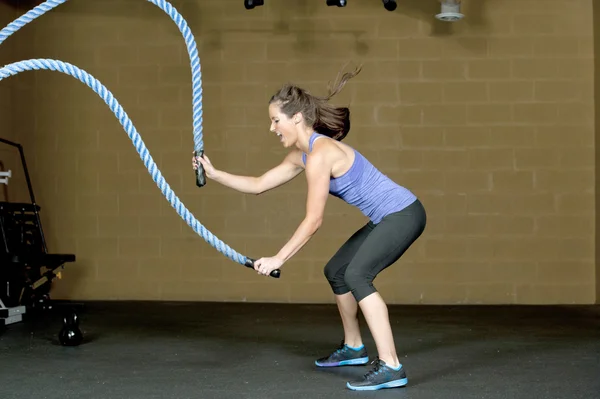 Woman training with atheltic training ropes — Stock Photo, Image