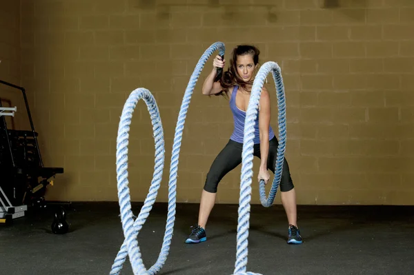 Woman training with atheltic training ropes — Stock Photo, Image