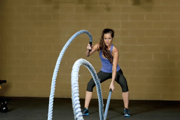 Woman training with atheltic training ropes — Stock Photo, Image