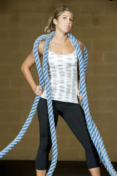 Woman posing with atheltic training ropes — Stock Photo, Image