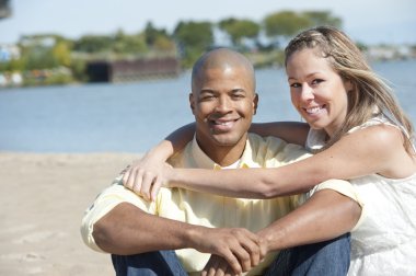 Interracial couple on the beach clipart